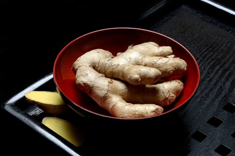 Ginger, ginger root in tea bowl, Zingiber officinale, tea preparation