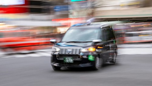 Black taxi driving, motion blur, long exposure, Shubuya Crossing, Shibuya, Tokyo, Japan