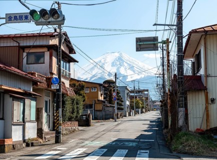 Street scene in a residential area, residential buildings and power lines, view of Mt. Fuji,