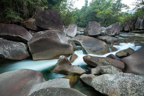 Turquoise blue water between rocks in the tropical rainforest of Babinda Boulders Queensland