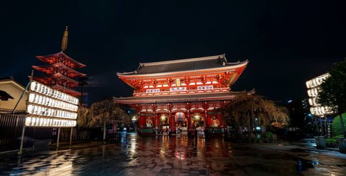 Illuminated five-story pagoda and main hall of Asakusa Shrine or Senso-ji Temple, at night,