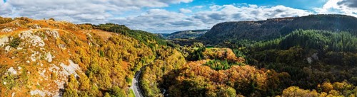 Autumn colours over Gwydir Forest Park from a drone, Afon Lledr, Road A470, Snowdonia, Eryri,