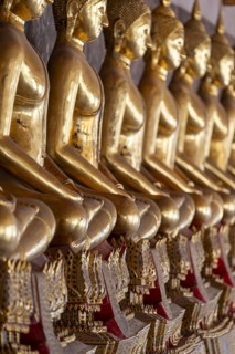 Gilded Buddha statues (Bhumispara mudra: Buddha Gautama at the moment of enlightenment), Wat Suthat