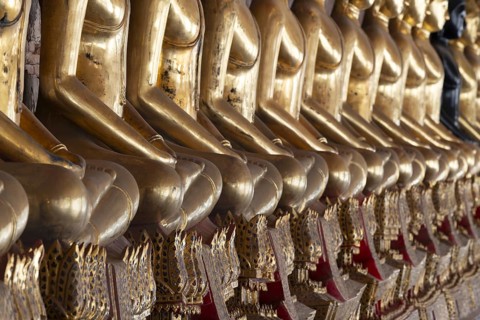 Gilded Buddha statues (Bhumispara mudra: Buddha Gautama at the moment of enlightenment), Wat Suthat