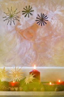 Christmassy decorated iced window, candle light, straw stars, Germany