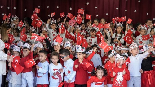 Children celebrate the 102nd anniversary of the Republic Day of Turkey, a national holiday