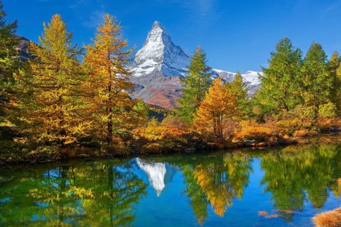 Matterhorn 4478 m with reflection in Lake Grindji in autumn, Zermatt, Mattertal, Valais,
