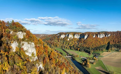 Aerial view, panorama of the Upper Danube Valley, surrounded by autumn vegetation with the
