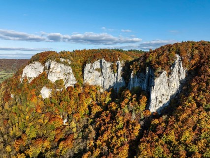 Aerial view of the Upper Danube Valley surrounded by autumn vegetation with the Hausender Peaks