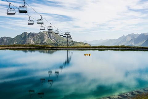Mountain landscape with reservoir and chairlift, Saloberkopf, Warth, Bregenzerwald, Vorarlberg,
