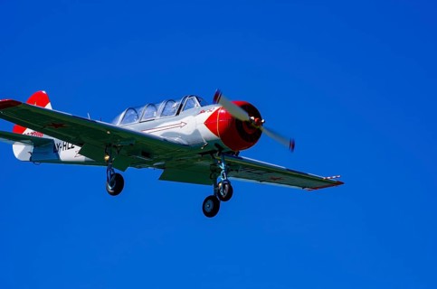 A Jakovlev Jak-52 with registration LY-HLZ during a flight demonstration as part of an air show on