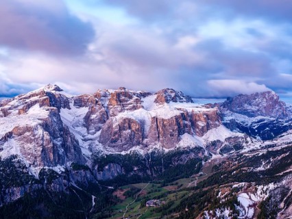 Sella group with fresh snow above the green Val Badia valley, Langkofel on the right, Dolomites,