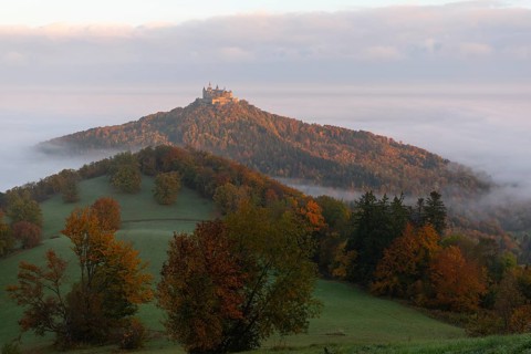 Hohenzollern Castle in a sea of fog at sunrise, autumn in the Swabian Jura