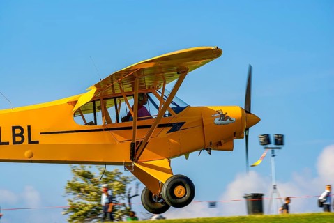 A Piper PA-18 Super Cub of the Bravo Lima Formation during a flight demonstration as part of an air