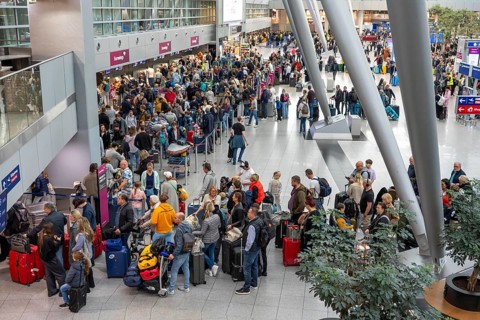 Full check-in hall, queues, Terminal B, many thousands of people take off on the first day of the