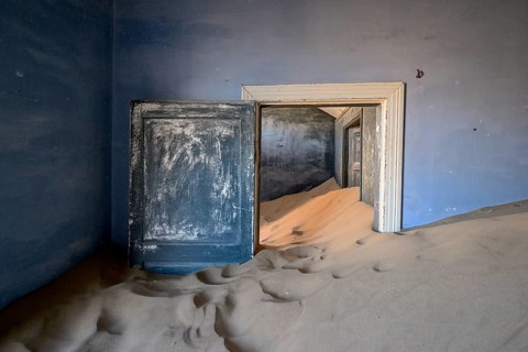 Former dwelling house full of sand, Kolmanskop, restricted diamond area, Karas region, Namibia