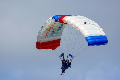 Two parachutists during an aerial acrobatic performance as part of an air show at the Rossfeld in
