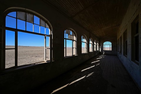 View into the desert from a former dwelling house, Kolmanskuppe, near Lüderitz, Karas Region,