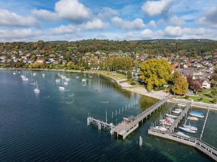 Aerial view of the village of Wangen on the Höri peninsula with boat moorings and jetty on the