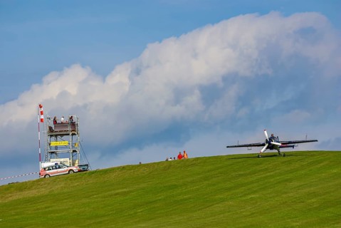 A Jakovlev Jak-55 with the registration LY-AGL during a flight demonstration as part of an air show