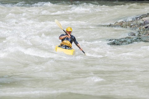 Young man kayaking in river, Costa Rica, Central America