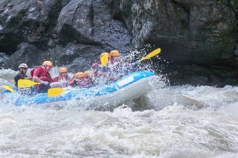 A group of people white water rafting, Costa Rica, Central America
