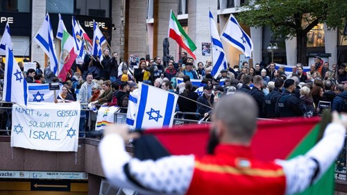 Numerous people gather for a vigil at the Hauptwache in Frankfurt am Main on the second anniversary