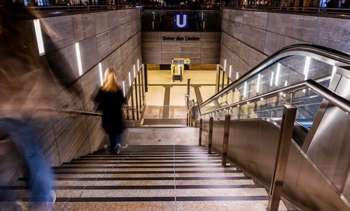Night photo, long exposure with motion blur, modern underground entrance at Unter den Linden