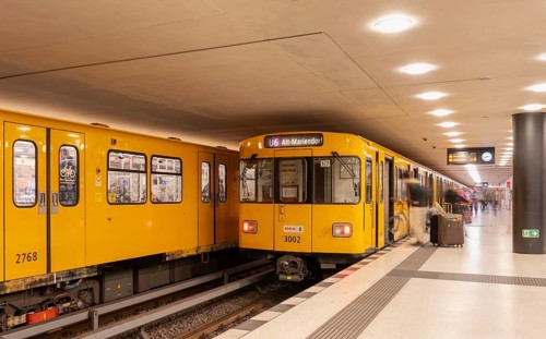Dynamic scene of a Berlin underground in typical yellow colour, long exposure with blur effect,