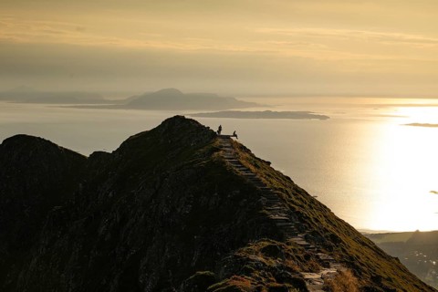 Hikers on the Rørsethornet stone staircase, with 3292 steps one of the longest continuous stone