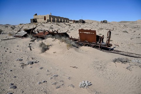 Wagon of an old narrow-gauge railway in the desert sand, Pomona, restricted diamond area, near