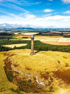 Waterloo Monument over Scottish fields and farms from a drone, Jedburgh, Scotland, UK