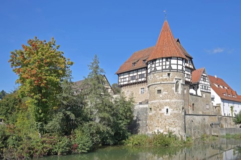 Zollern Castle built around 1255 with water tower on the Eybach stream, half-timbered house,