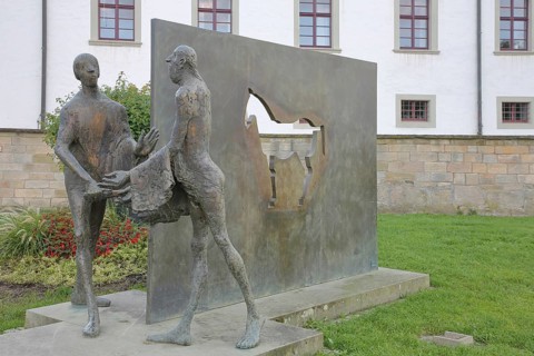 Sculpture Martin of Tours by Karl Ulrich Nuss, Saint Martin sharing his cloak with a beggar, symbol