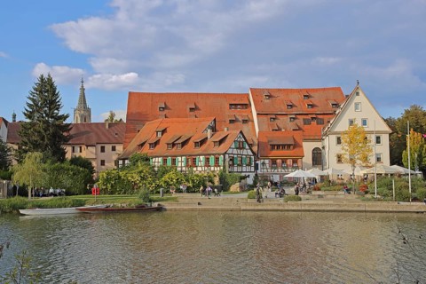 Half-timbered houses, town mill, tithe barn on the banks of the Neckar, pedestrians, boats,