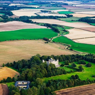 Wedderburn Castle and Barns over fields from a drone, Duns, Berwickshire, Scotland, UK