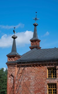 Gable with weather vane and ornamental iron elements, former paper factory and mill for the