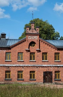 Brick façade with inscription Werla, former paper factory and mill for the production of groundwood