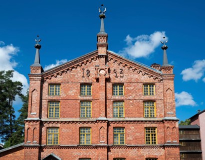 Multi-storey brick façade with inscription 1893, former paper factory and mill for the production