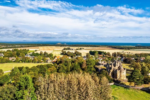 Ruins of Dirleton Castle & Gardens from a drone, Dirleton, East Lothian, Scotland, UK