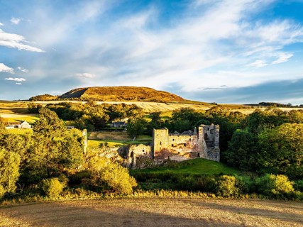 Ruins of Hailes Castle over River Tyne from a drone, East Linton, East Lothian, Scotland, UK