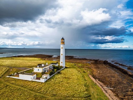 Rain Clouds over Barns Ness Lighthouse from a drone, Dunbar, East Lothian, Scotland, UK