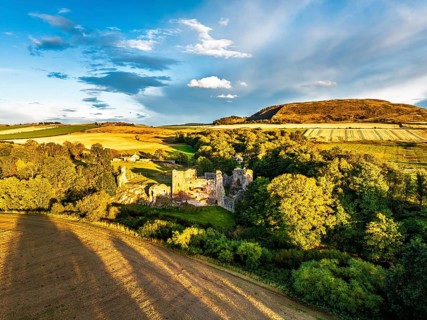 Ruins of Hailes Castle over River Tyne from a drone, East Linton, East Lothian, Scotland, UK