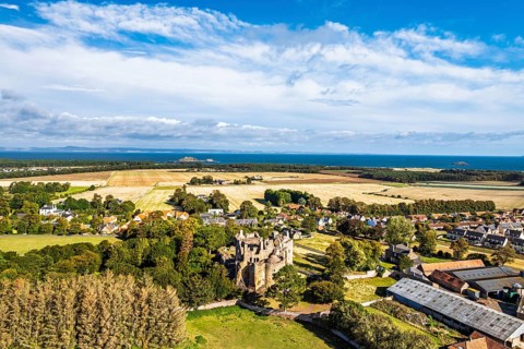 Ruins of Dirleton Castle & Gardens from a drone, Dirleton, East Lothian, Scotland, UK