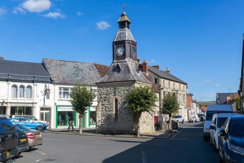 Historic Clock Tower building in the Market Place, Mere, Wiltshire, England, UK