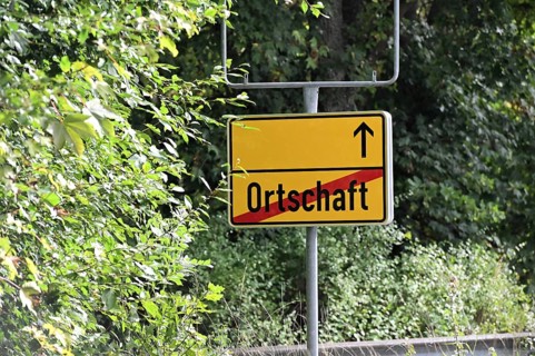Instead of the usual place name sign, a replacement place name sign has been installed in the