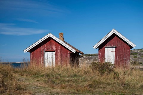 Falun red or Swedish red boathouses by the sea, Resö Island, Bohuslän, Skagerrak, Sotenäs, Västra