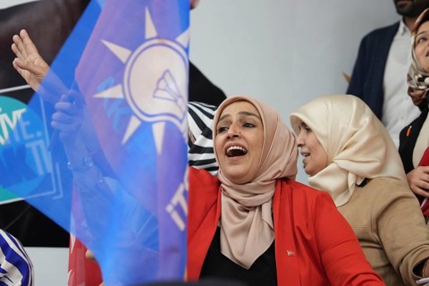 Gaziantep, Türkiye – May 28, 2023. Turkish citizens wave flags of Türkiye and the ruling Justice