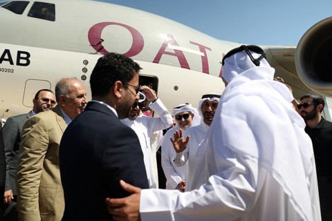 Syrian Health Minister Musab al-Omar welcomes a Qatari aircraft loaded with medical and