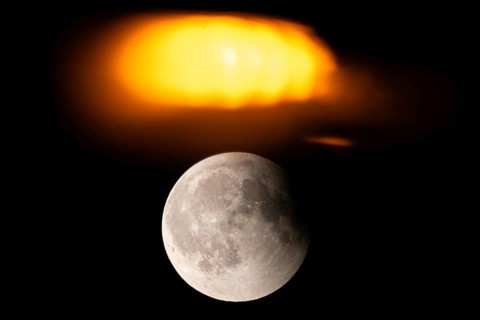 After a total lunar eclipse, the moon appears shortly after its rise in the evening sky as a